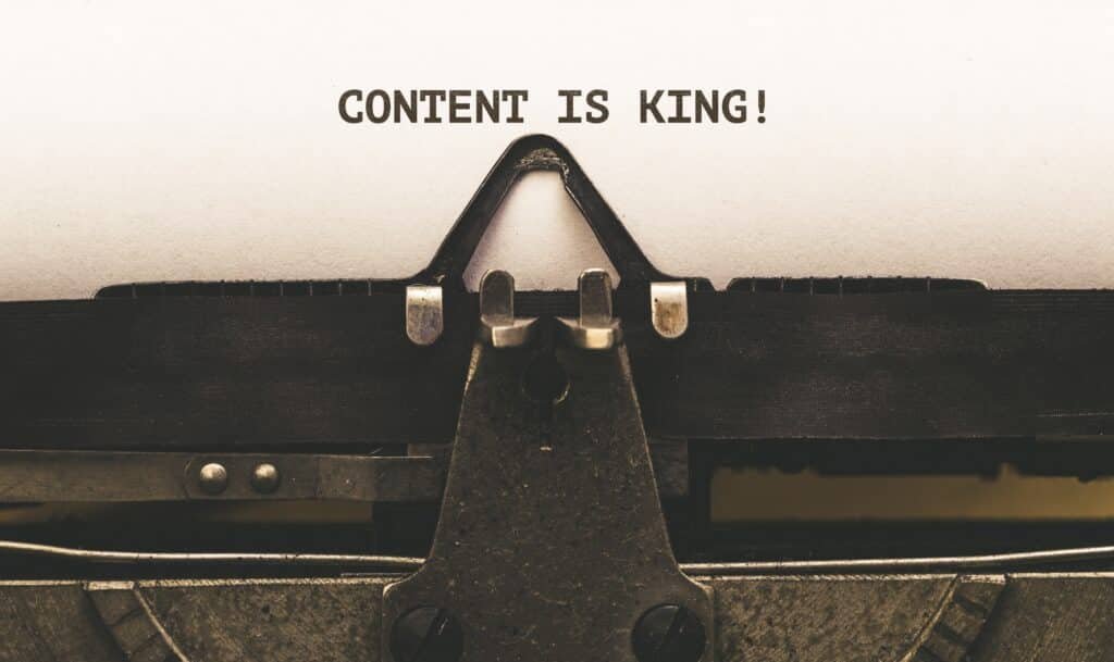 Content is King, Text on paper in Vintage type writer machine from 1920s closeup with paper