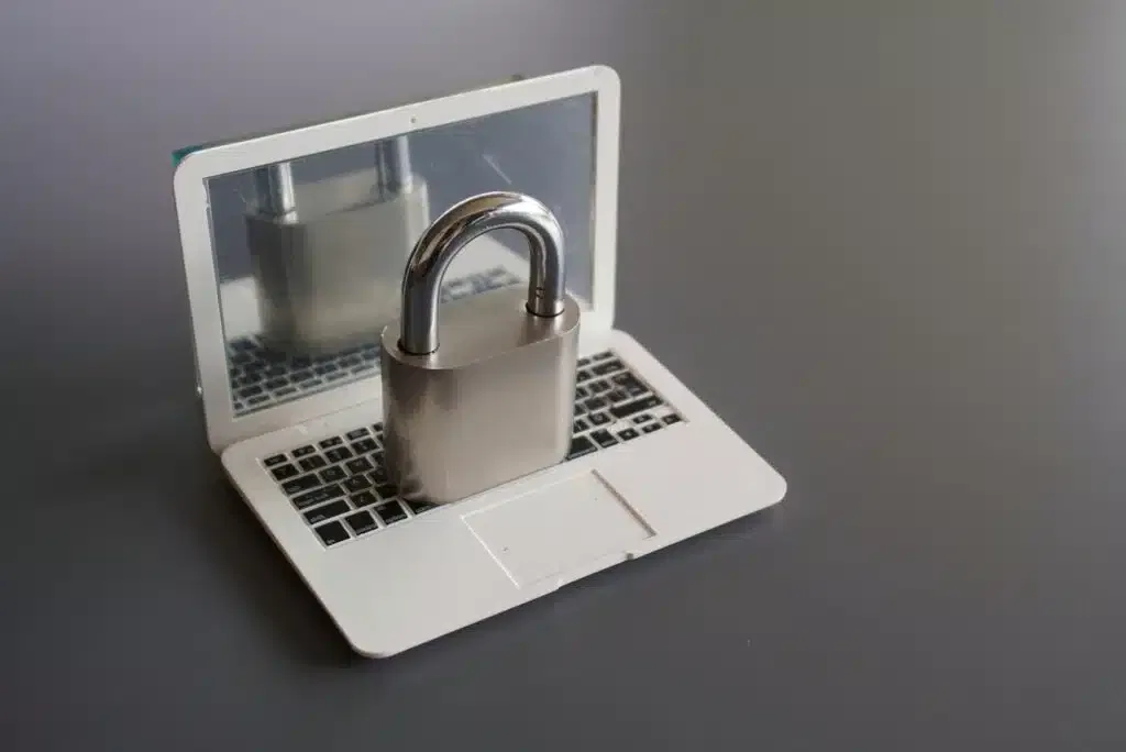 Closeup image of laptop and padlock with copy space.